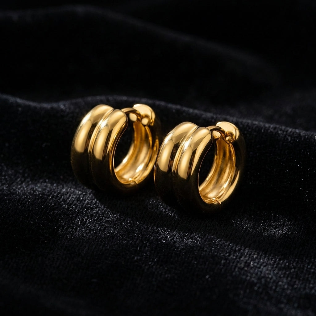 Chunky Gold Huggie Hoop Earrings on black velvet