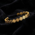 Gold Daisy Flower Cuff Bracelet on black velvet