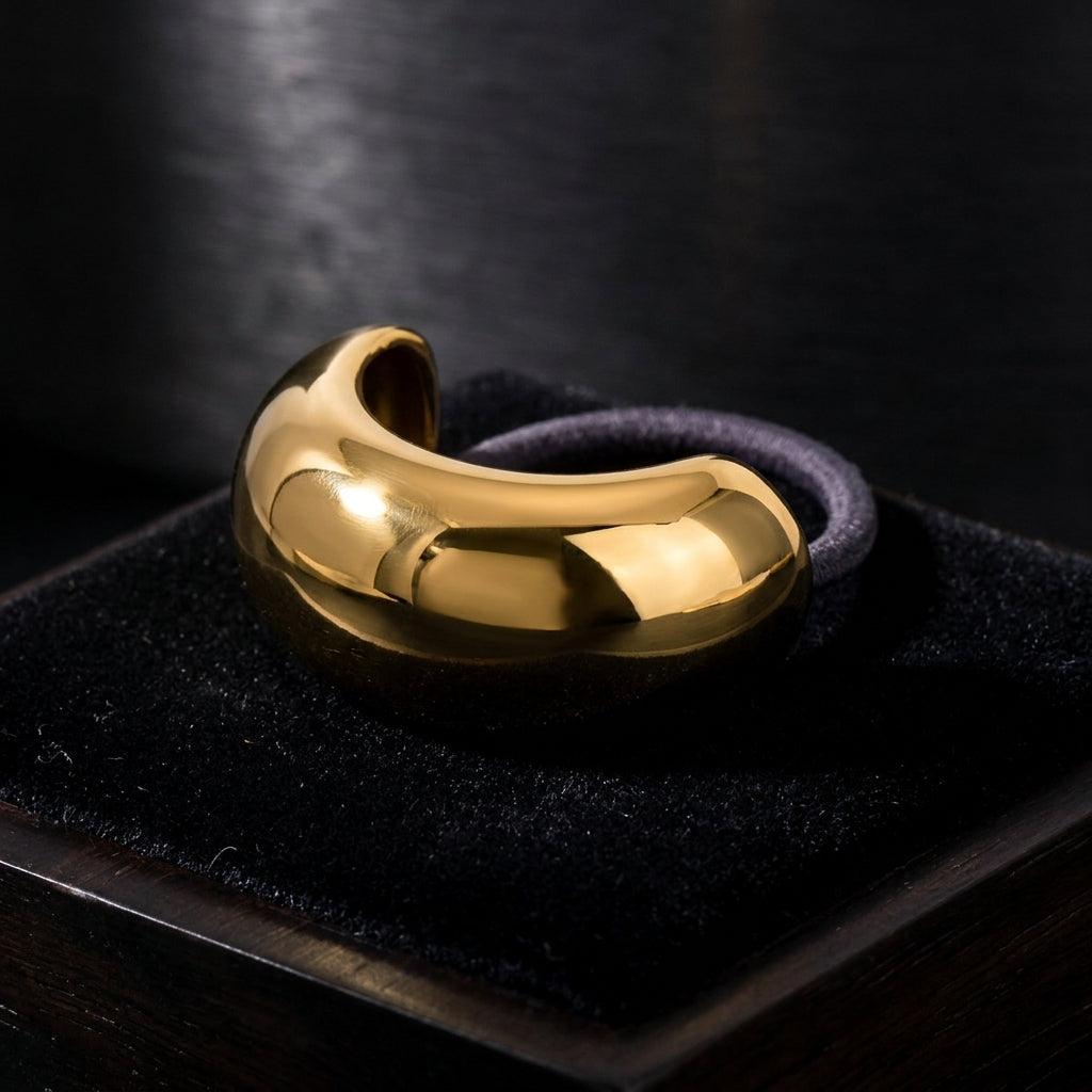 Gold Bubble Hair Tie on black velvet
