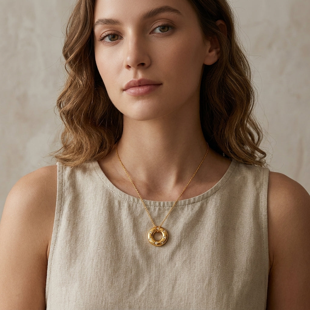Gold Crystal Donut Pendant Necklace worn on neck
