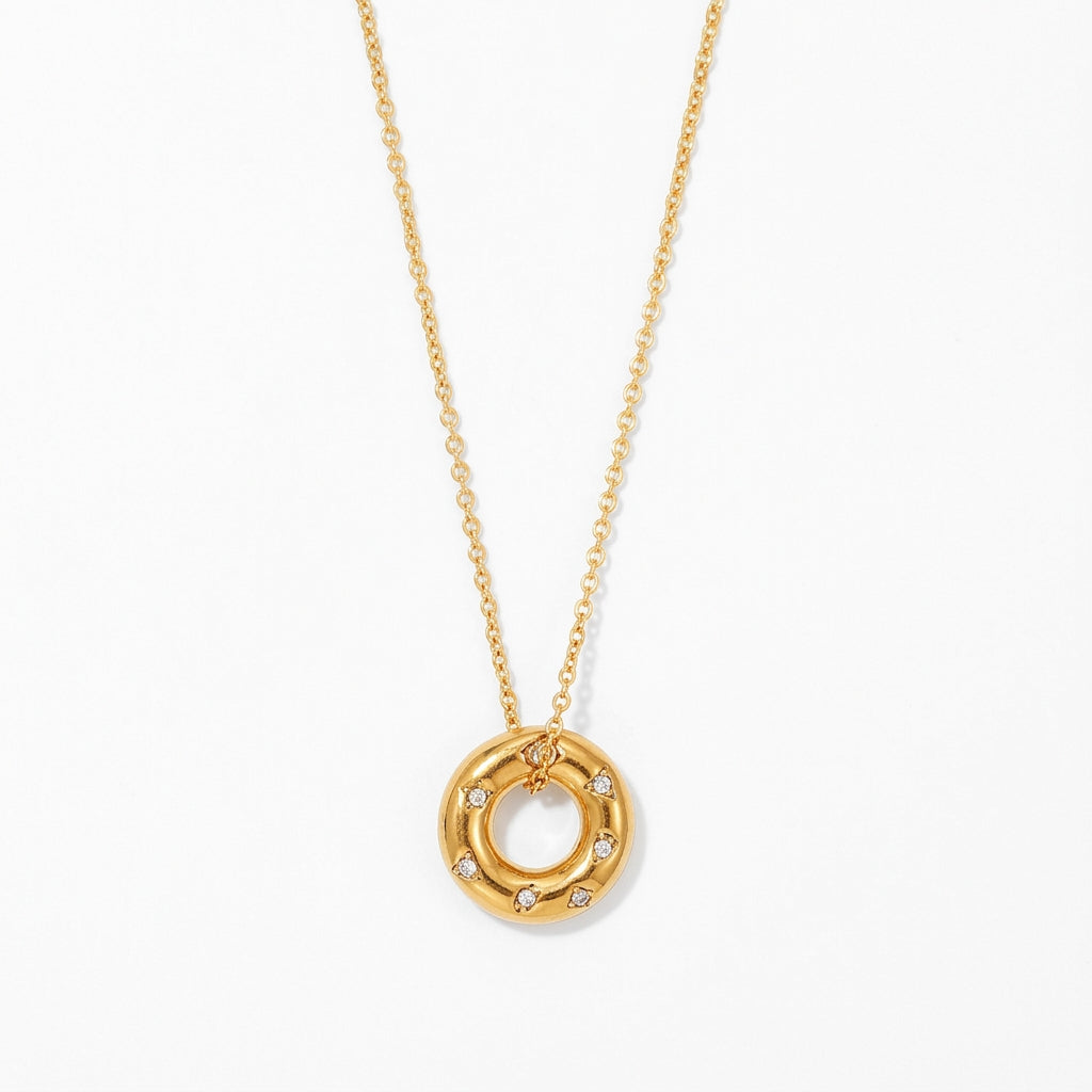 Gold Crystal Donut Pendant Necklace on white background
