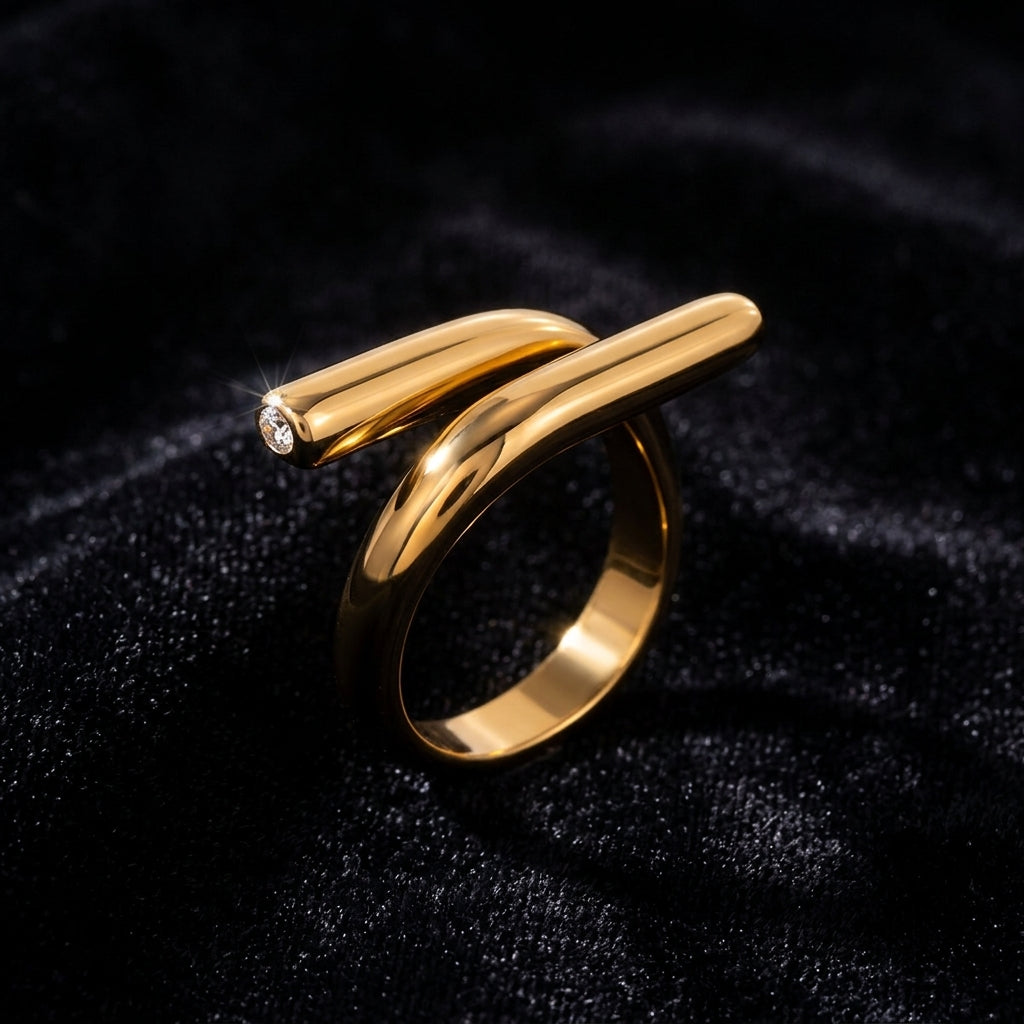 Sculptural Gold Nail Ring on black velvet