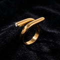 Sculptural Gold Nail Ring on black velvet