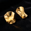 Crumpled Wave Gold Stud Earrings on black velvet
