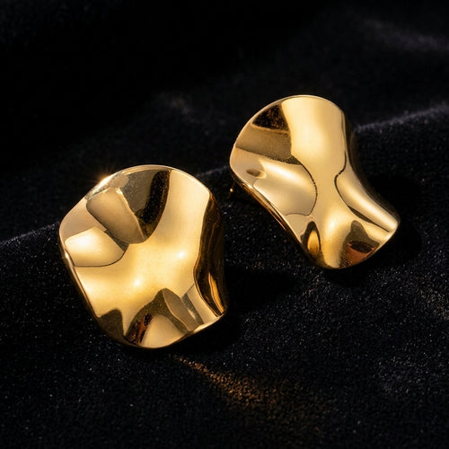 Crumpled Wave Gold Stud Earrings on black velvet