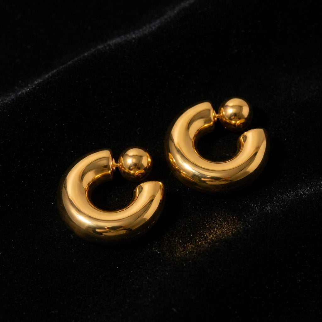 Chunky Gold Hoop Earrings - Product on black velvet background