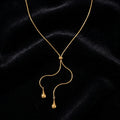 Minimalist Y-Lariat Necklace - Product on black velvet background