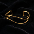 Open Wave Wire Cuff Bracelet - Product on black velvet background