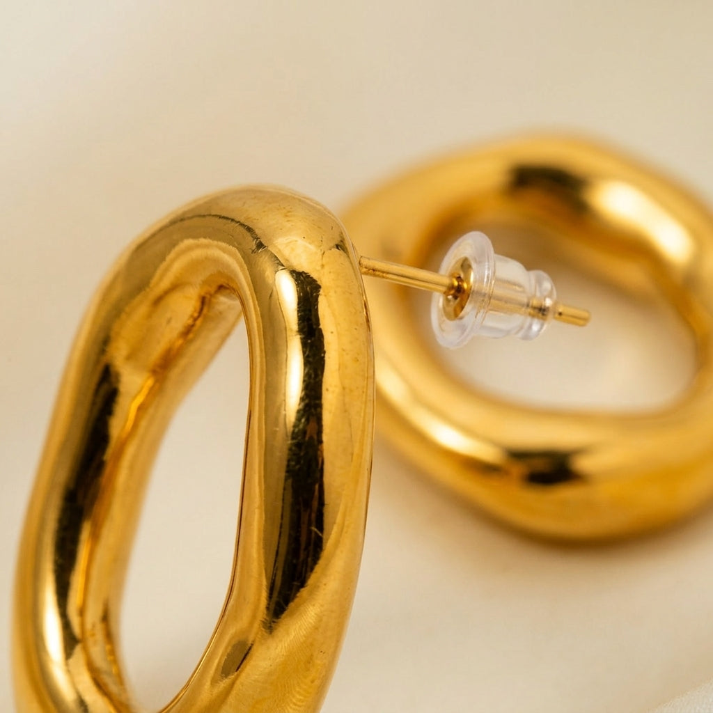 Sculpted Gold Oval Hoop Earrings detail closeup